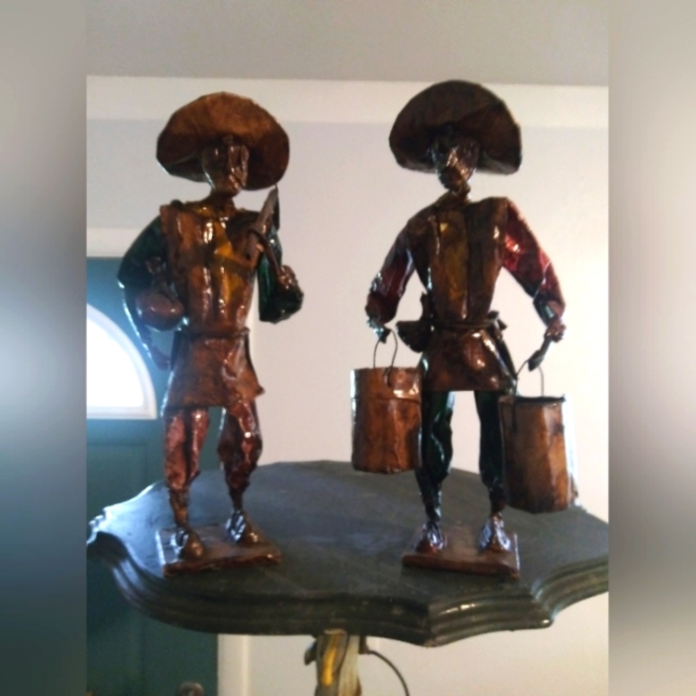Two paper mache men
